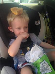 Very soon, this handsome little boy will convert the grilled cheese and chips into poop.